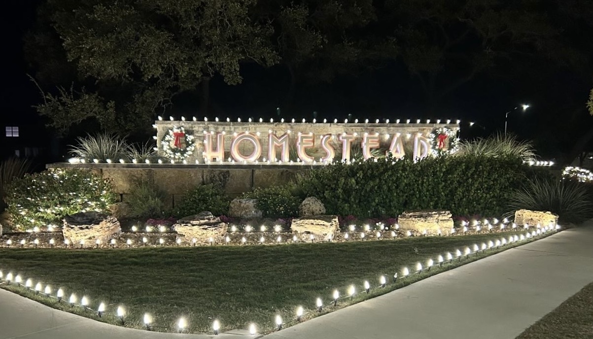 Homestead Community entrance sign lit for the holidays in Leander, Texas